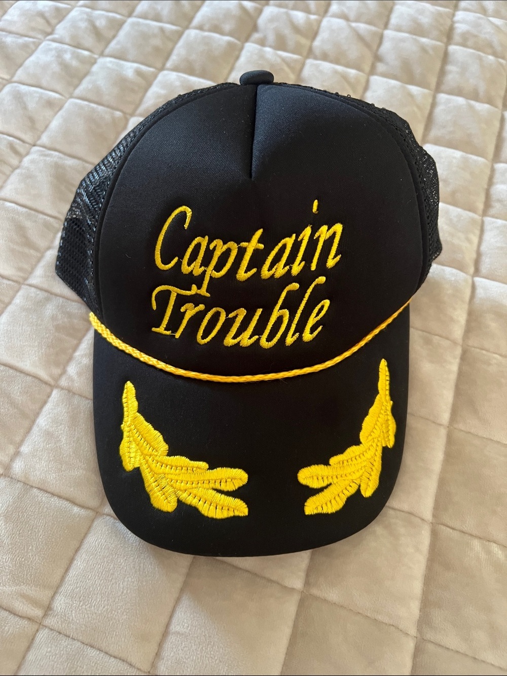 Captain Trouble Black Trucker Hat with Yellow Embroidery